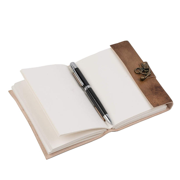 A6 note pad open, showing recycled white unlined paper, with a pen placed inside