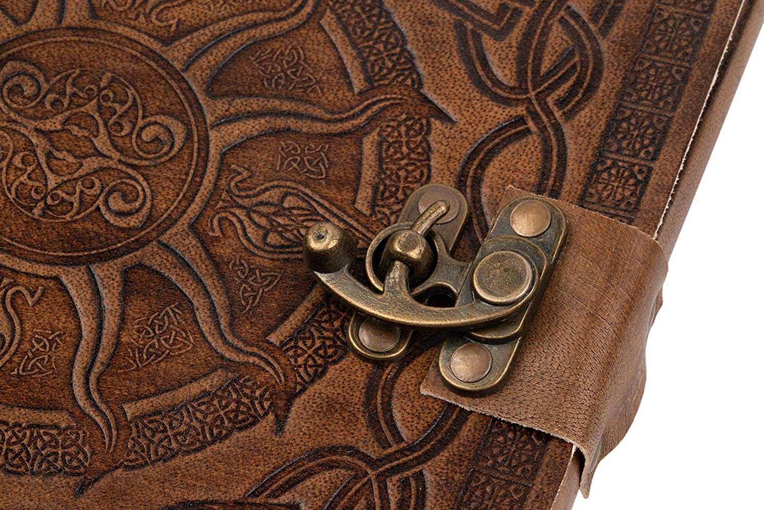 Close up of Celtic sun embossing on leather journal and brass metal clasp