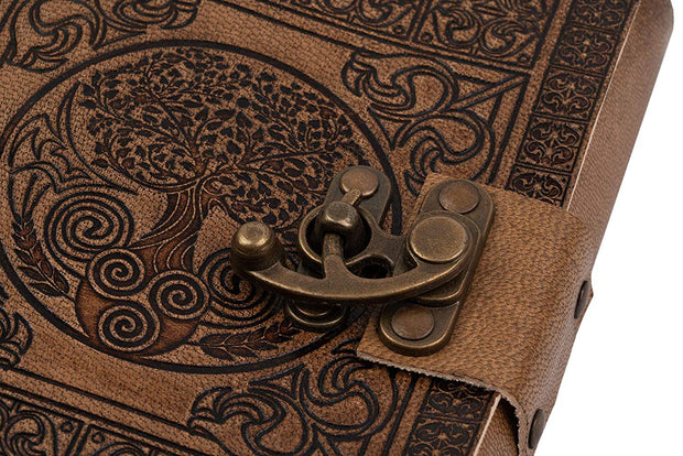 Close up of Tree of Life embossing and brass metal clasp secured journal
